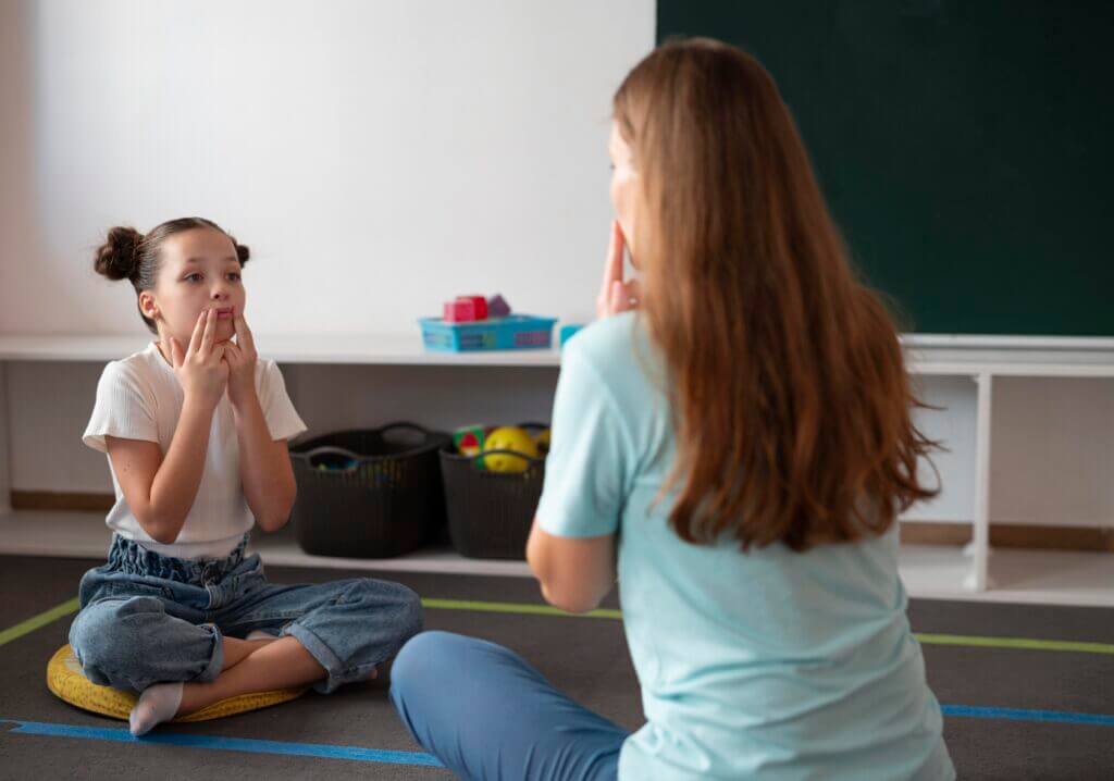 psychologist-helping-girl-speech-therapy-min